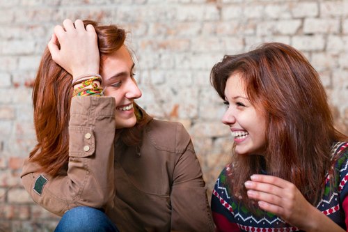 two college students laughing