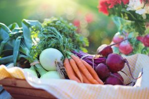 onion, carrots and beets in a basket