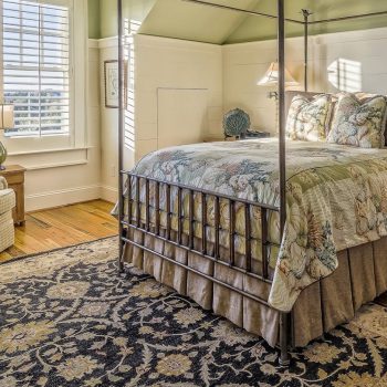 bedroom with hardwood floors and carpet