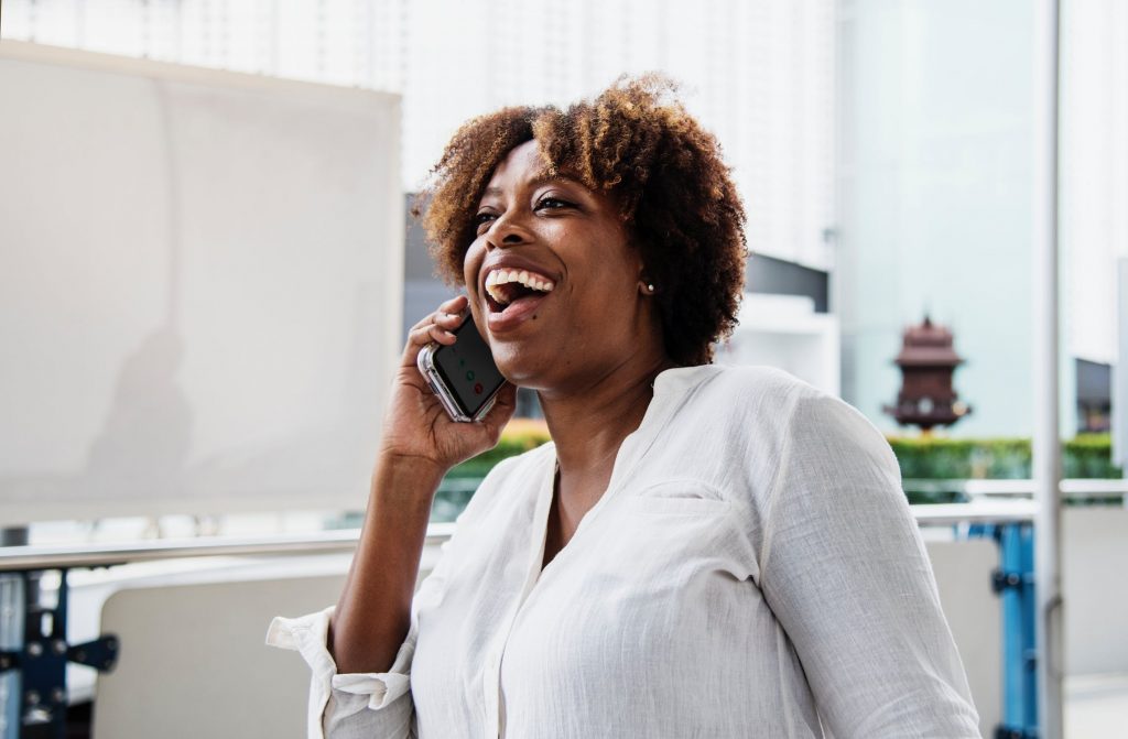 woman laughing on the phone